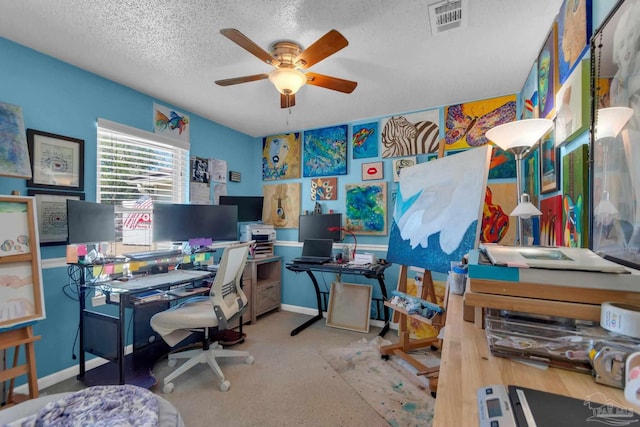 office featuring a textured ceiling and ceiling fan