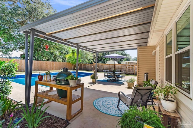 view of patio with a fenced in pool