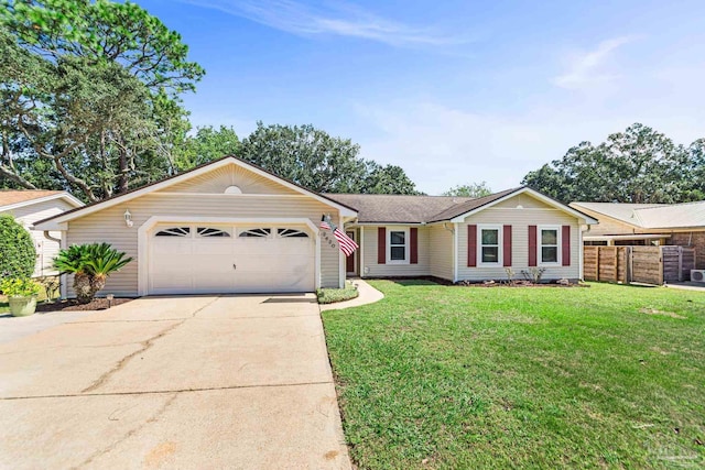 single story home with a garage and a front lawn