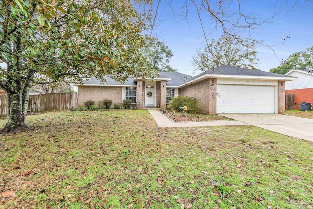 ranch-style home featuring a garage and a front yard