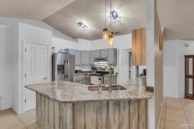 kitchen featuring pendant lighting, appliances with stainless steel finishes, kitchen peninsula, and light tile patterned flooring