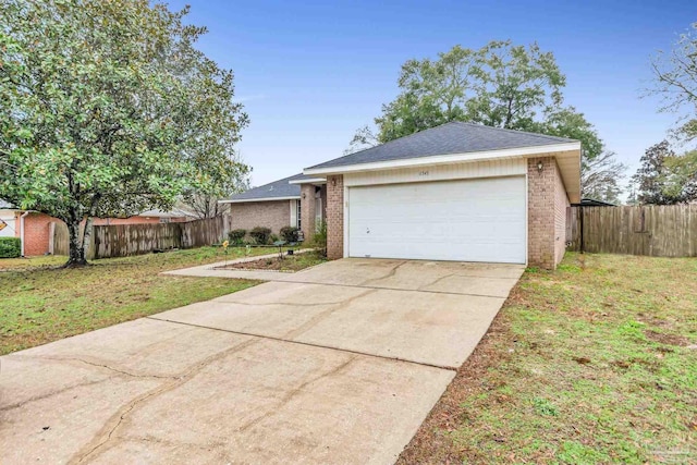 ranch-style home with a garage and a front yard