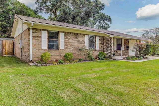 single story home with a front yard