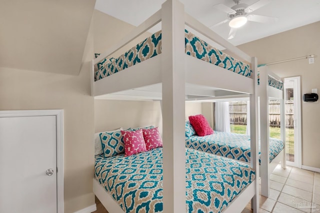 bedroom featuring light tile patterned floors and ceiling fan