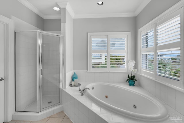 bathroom featuring independent shower and bath, crown molding, and tile patterned flooring