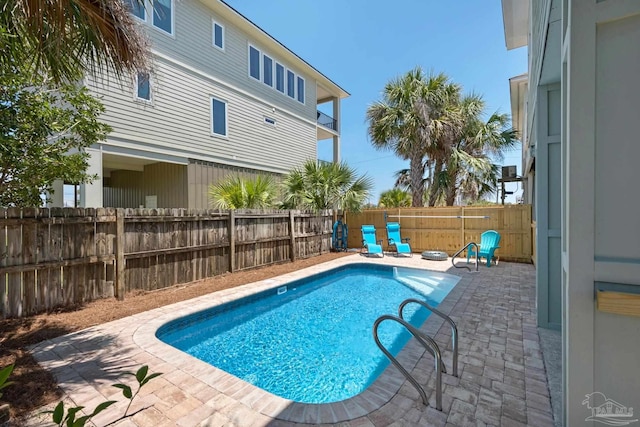 view of swimming pool featuring a patio