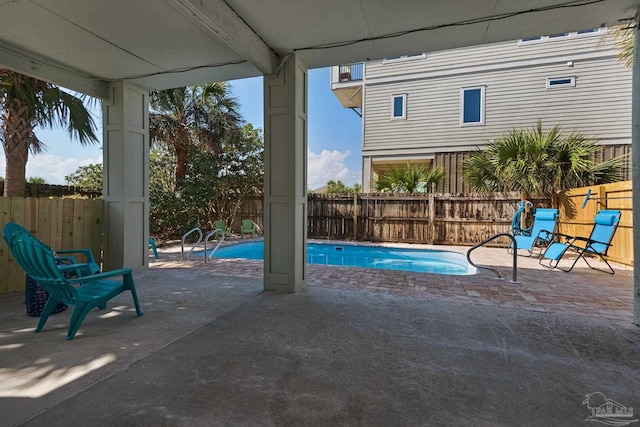 view of swimming pool with a patio area