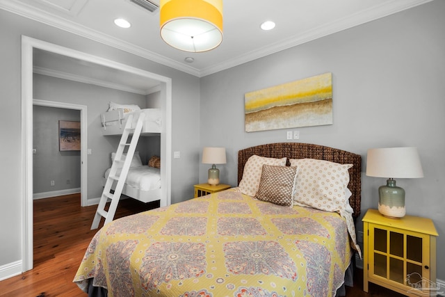 bedroom featuring wood-type flooring and crown molding