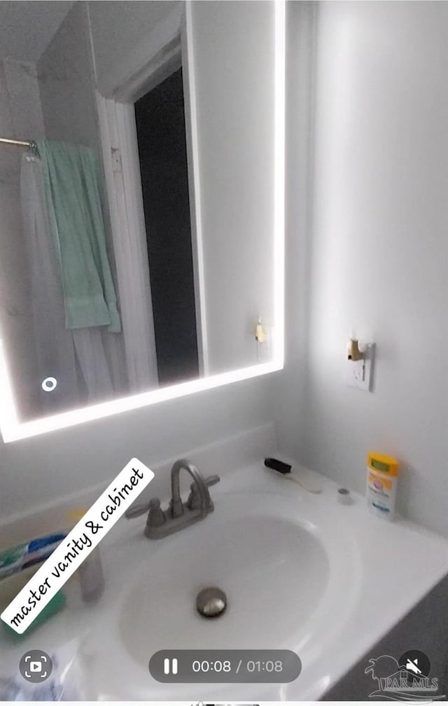 full bath with vanity and a shower with curtain