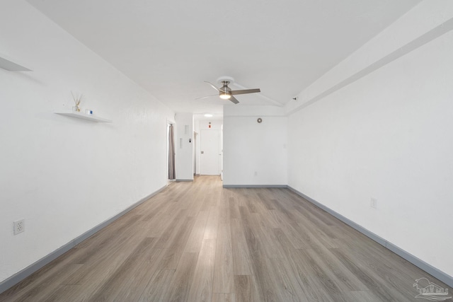 empty room featuring light hardwood / wood-style floors and ceiling fan