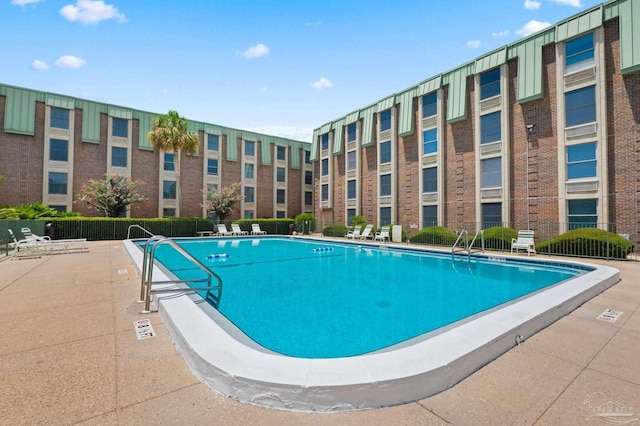 view of pool featuring a patio area