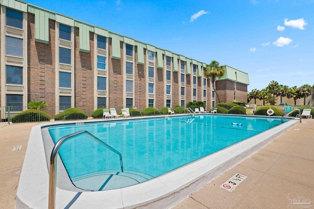 view of pool featuring a patio