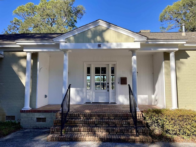 property entrance with covered porch