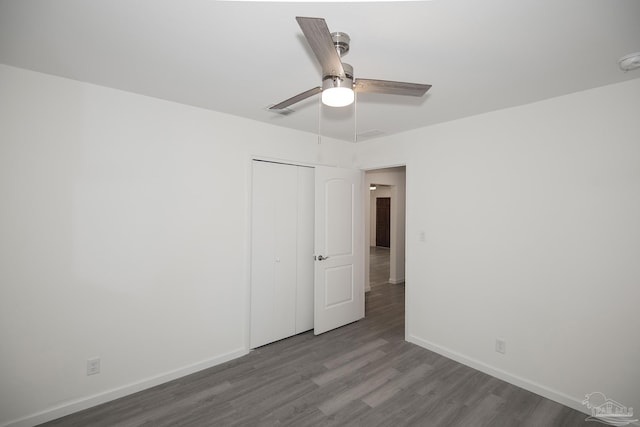 spare room with ceiling fan and light wood-type flooring