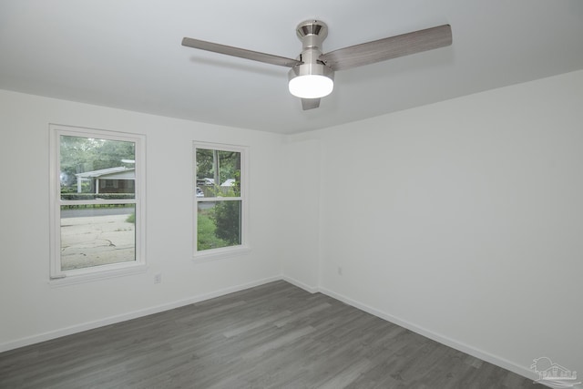 spare room featuring dark wood-type flooring