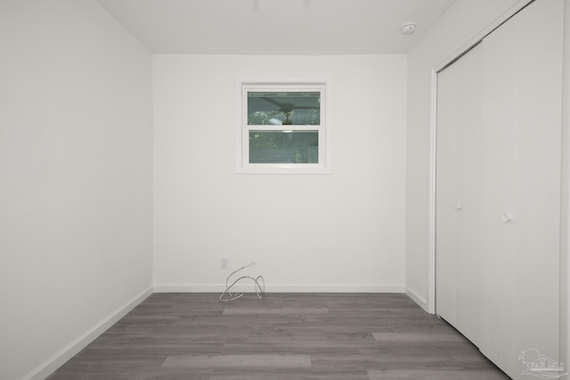 empty room with hardwood / wood-style floors