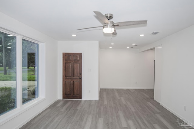 spare room with ceiling fan and light hardwood / wood-style floors