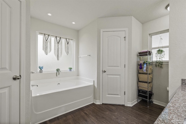 4327 Thistle Pine Ct, Pace, FL 32571 - bathroom featuring a bath and wood finished floors