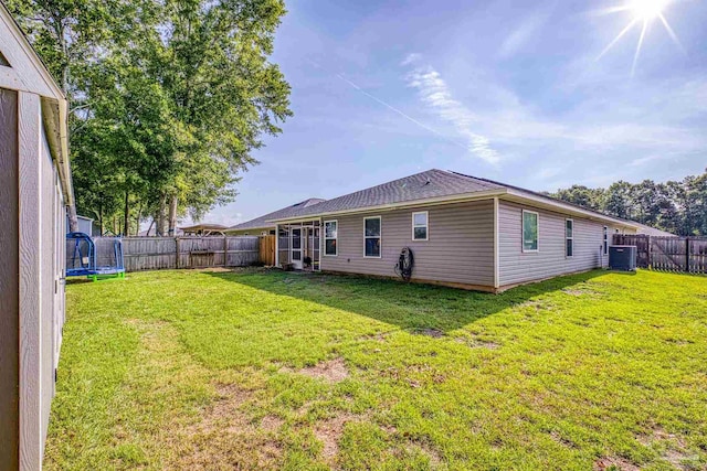 4327 Thistle Pine Ct, Pace, FL 32571 - back of house with a trampoline and a fenced backyard