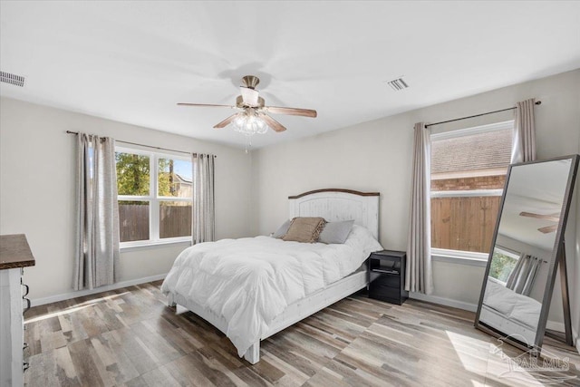 bedroom featuring ceiling fan and light hardwood / wood-style flooring