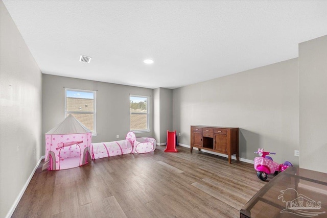 recreation room with hardwood / wood-style flooring