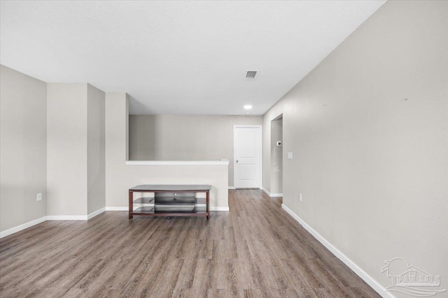 unfurnished living room featuring wood-type flooring