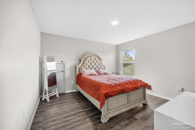 bedroom featuring dark hardwood / wood-style flooring