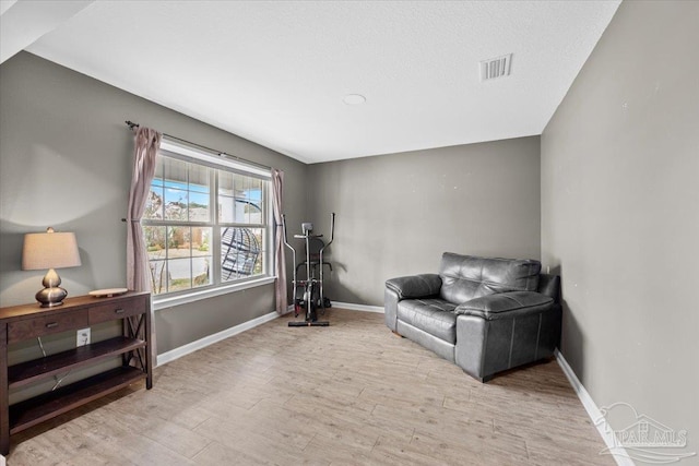 living area with light hardwood / wood-style floors