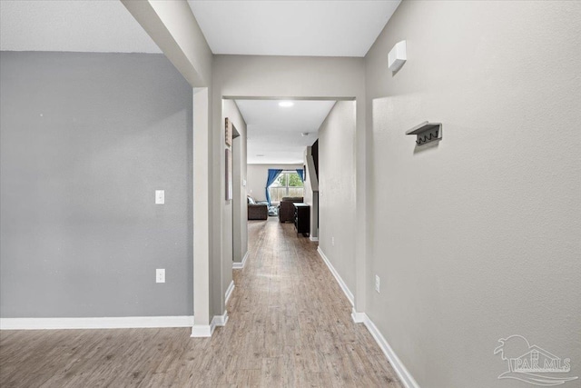 corridor featuring light hardwood / wood-style flooring