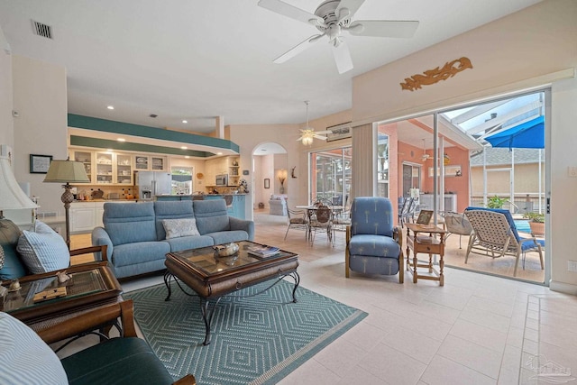 living room with ceiling fan and light tile patterned floors