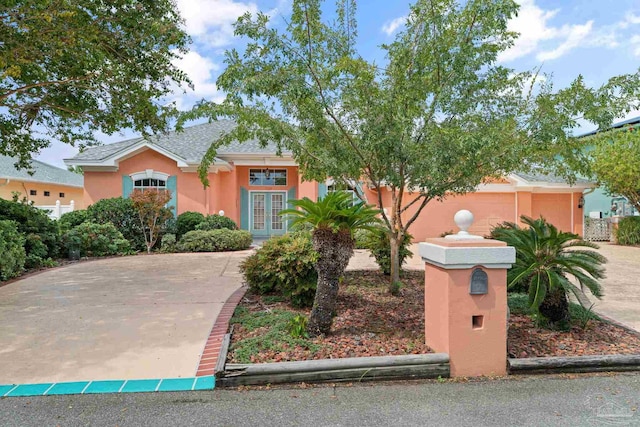 view of front of property with french doors and stucco siding