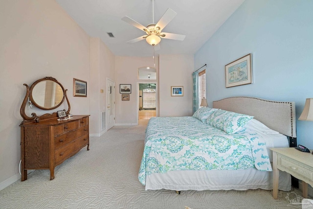 bedroom with light carpet and ceiling fan