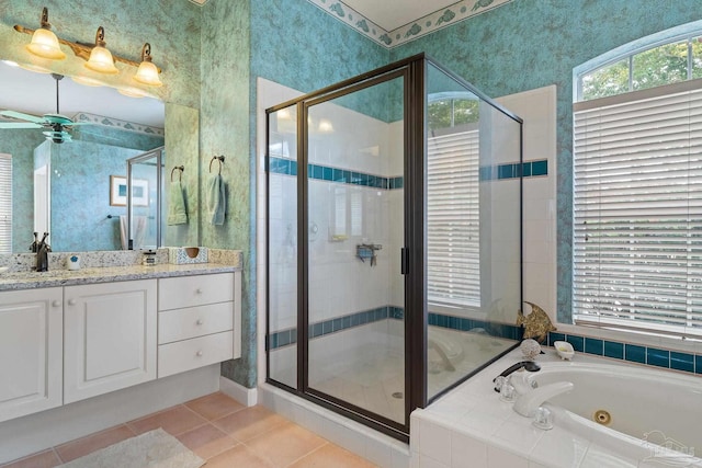 bathroom featuring vanity, separate shower and tub, tile patterned flooring, and ceiling fan