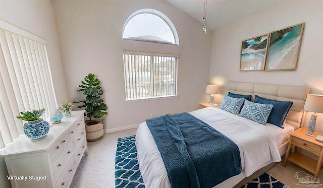 1129 Seabreeze Ln, Gulf Breeze, FL 32563 - bedroom featuring light colored carpet, lofted ceiling, and baseboards