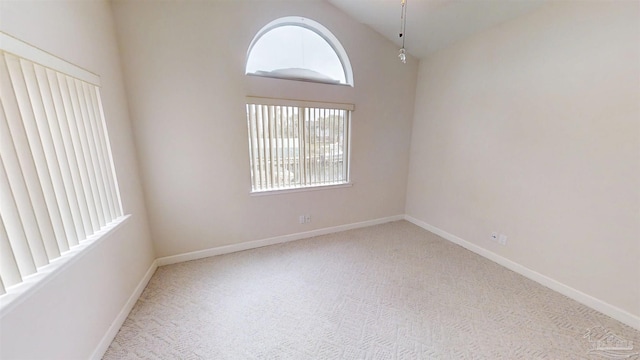 1129 Seabreeze Ln, Gulf Breeze, FL 32563 - unfurnished room featuring high vaulted ceiling, carpet, and baseboards