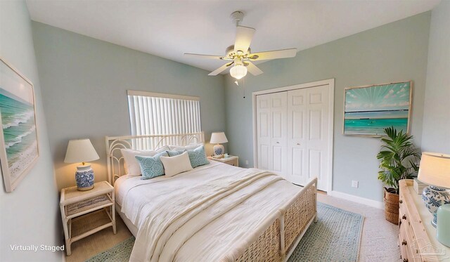 1129 Seabreeze Ln, Gulf Breeze, FL 32563 - carpeted bedroom featuring a closet, ceiling fan, and baseboards