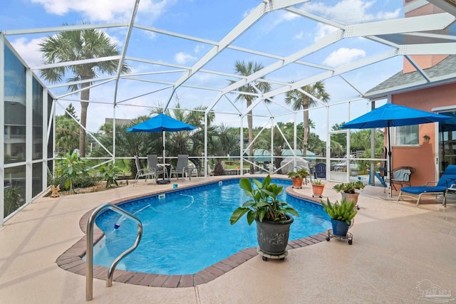 view of pool with a lanai and a patio area