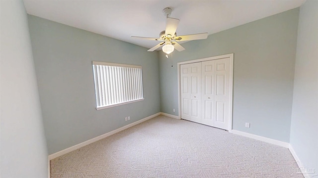 1129 Seabreeze Ln, Gulf Breeze, FL 32563 - unfurnished bedroom featuring baseboards, a closet, ceiling fan, and carpet flooring