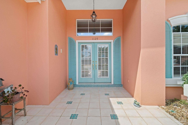 doorway to property featuring a patio area and french doors