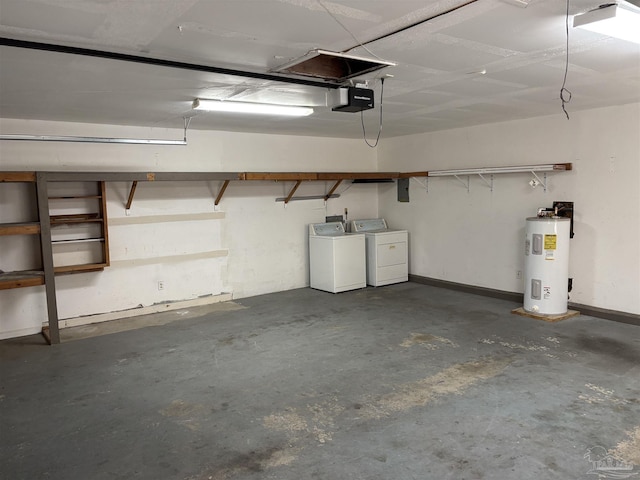 garage featuring baseboards, electric water heater, independent washer and dryer, and a garage door opener