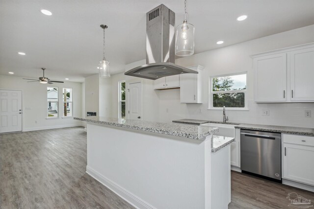 kitchen featuring sink, island exhaust hood, dishwasher, ceiling fan, and wood-type flooring