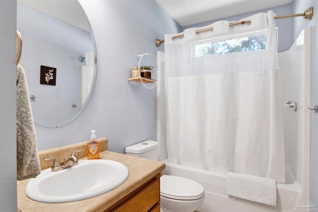 full bathroom featuring vanity, toilet, a textured ceiling, and shower / bath combo