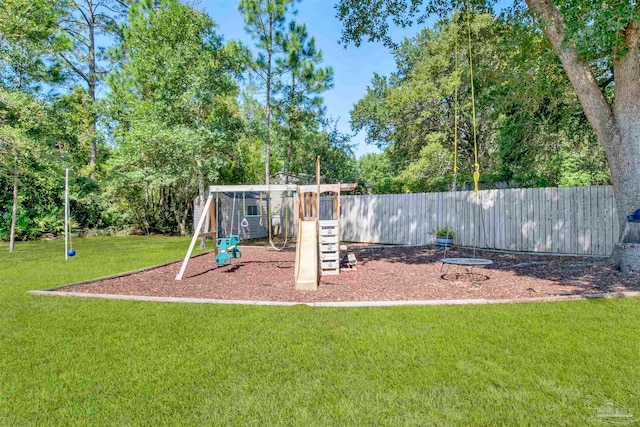 view of playground with a lawn