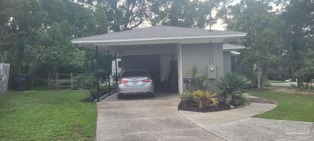 view of side of home with a carport and a yard