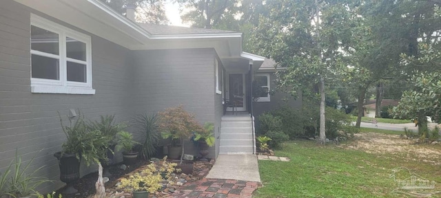 view of side of home featuring a yard