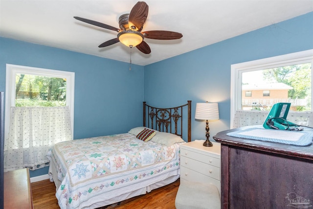 bedroom featuring wood-type flooring and ceiling fan