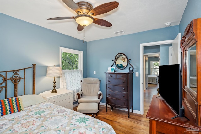 bedroom featuring light wood-type flooring and ceiling fan