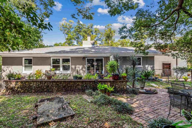 view of front of house with a patio area