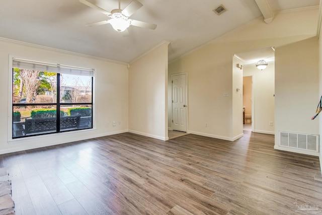 empty room featuring hardwood / wood-style flooring, ornamental molding, vaulted ceiling with beams, and ceiling fan