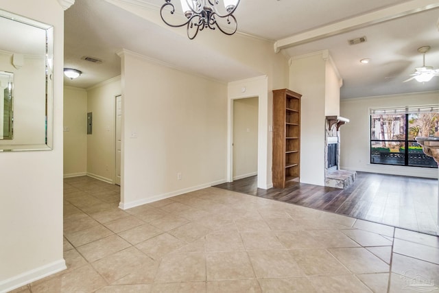 unfurnished living room with crown molding, electric panel, ceiling fan with notable chandelier, and light tile patterned floors